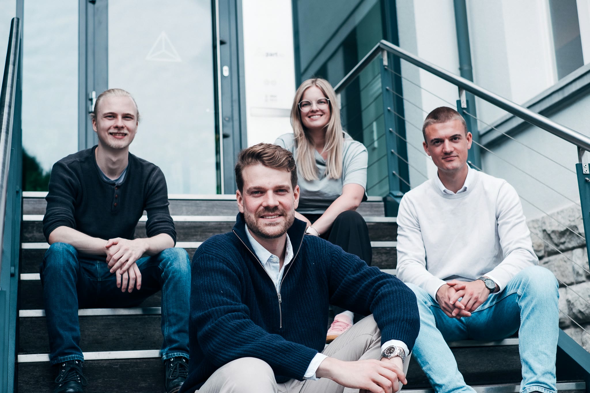 Conlivo Team auf der Treppe